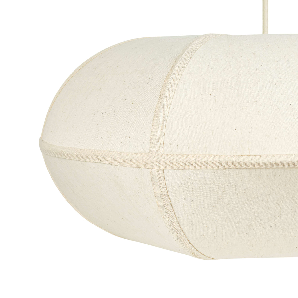 Angle view of the FOAK Josephine oblong pendant fixture illuminated over a dining table