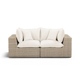 Cali 80-inch Performance Fabric and Wicker Outdoor Loveseat front view with neutral cushions