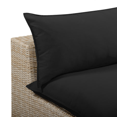 Rear view of the black resin wicker frame on the Cali outdoor slipper chair