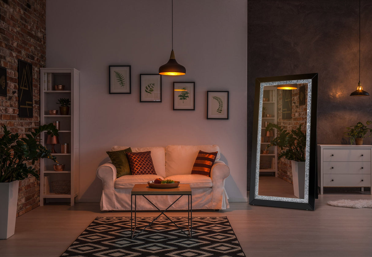 Nexus standing mirror positioned in a bedroom setting showing its freestanding frame