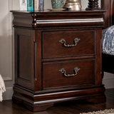 A dark brown wooden nightstand with two drawers and ornate metal handles, shown in a bedroom setting next to a bed.